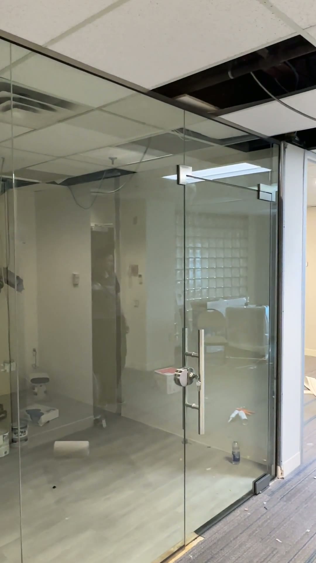 Clear glass private office enclosure with polished pull hardware