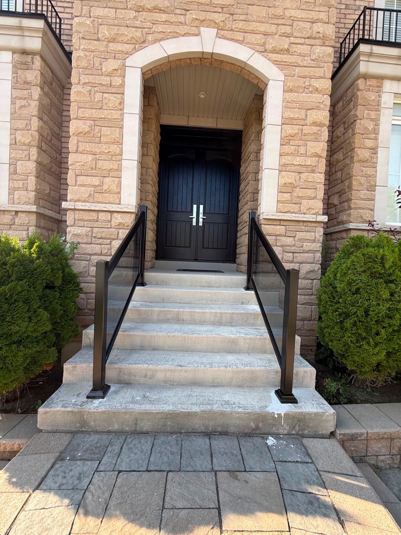 Front entry steps with glass railing panels