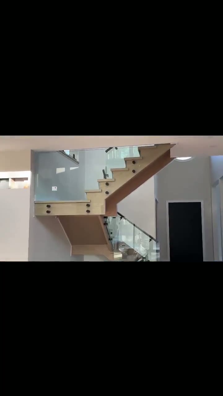 Glass railing turning the stair landing