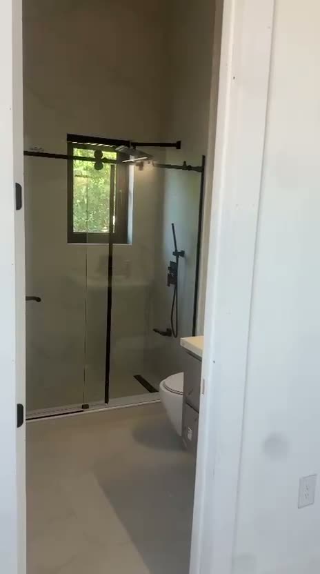 Black-framed glass shower door detail