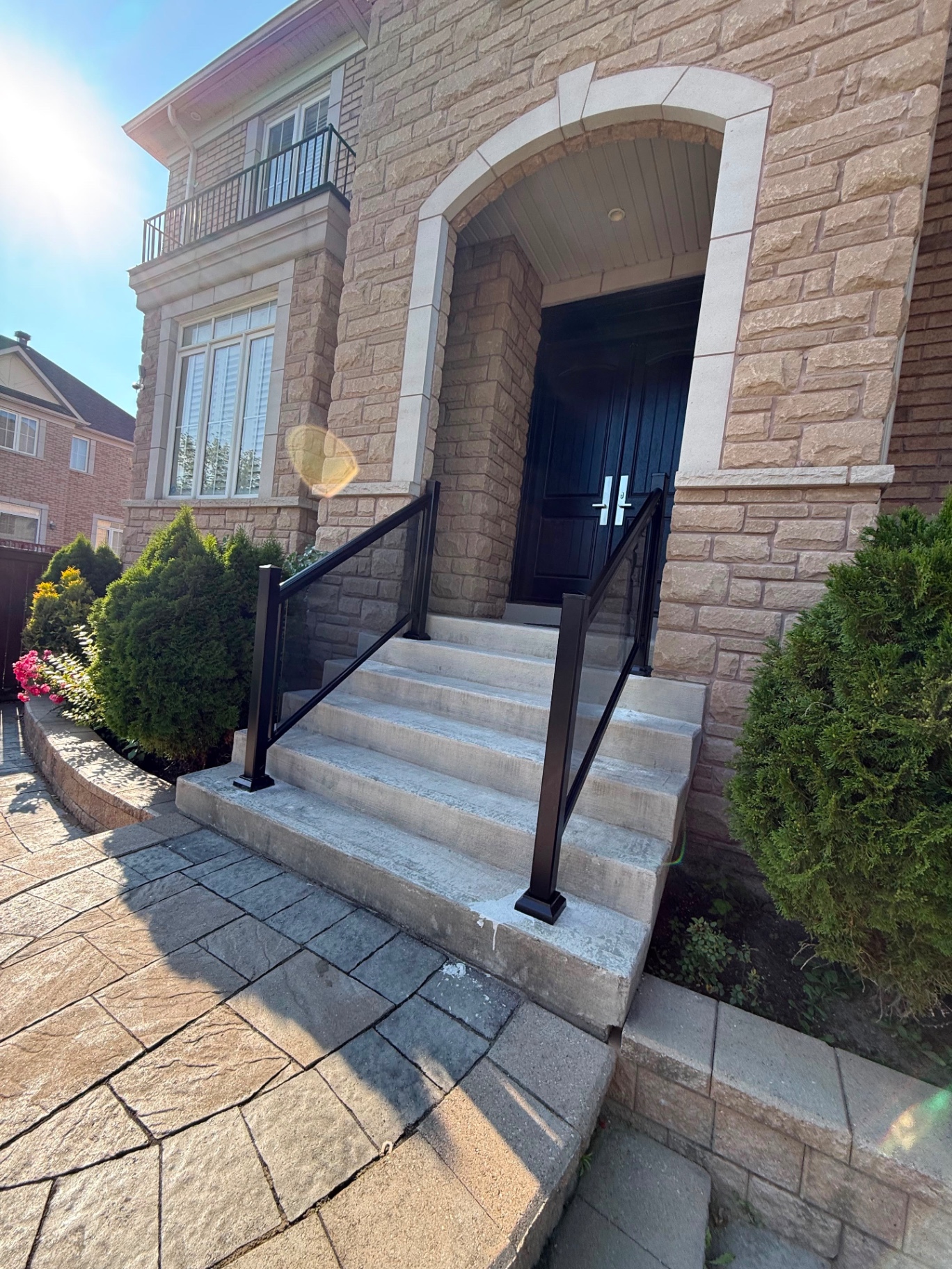 Angled view of the front entry glass railing