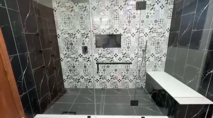 Interior view of the frameless shower with floating bench