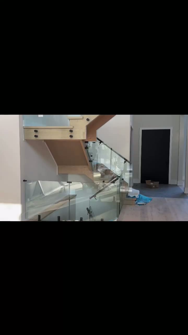 Frameless glass stair railing installation